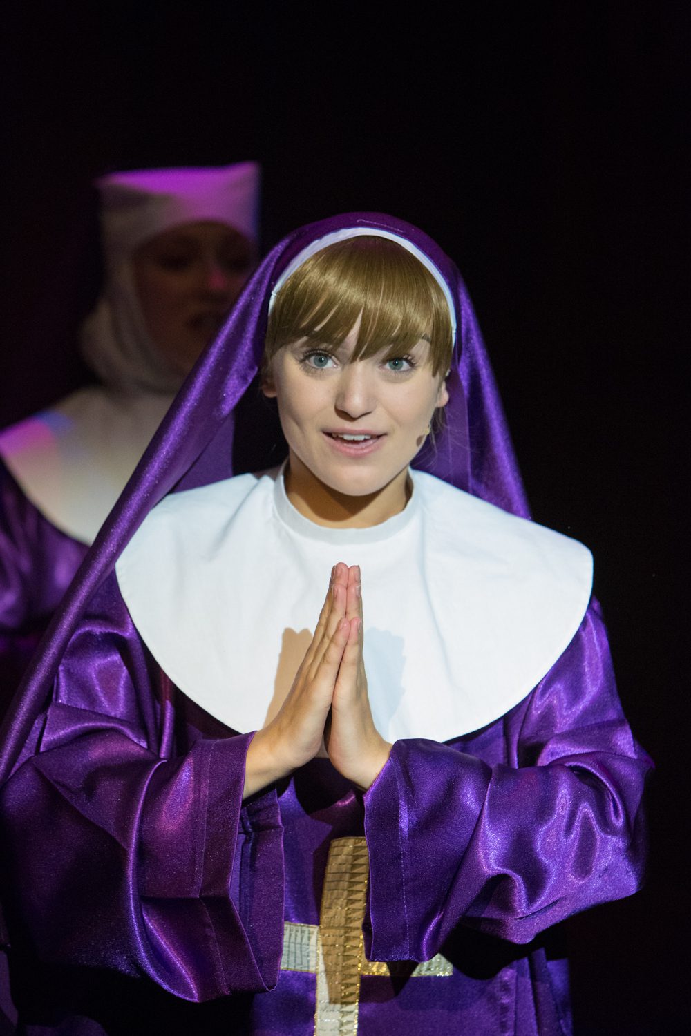 Purple Nuns costumes with white wimple&apos;s, vails, shoes and crosses for Sister Act the Musical.